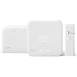 White tado V3+ smart thermostat with wireless receiver