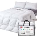 Homescapes goose feather and down 13.5 tog duvet on a bed with its storage bag