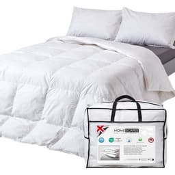 Homescapes goose feather and down 13.5 tog duvet on a bed with its storage bag